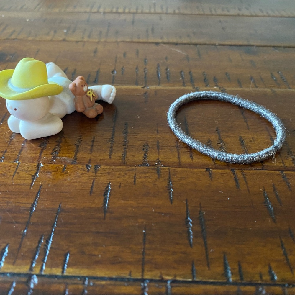 Charming ceramic baby boy  wearing cowboy hat